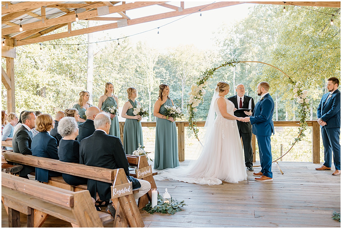 Wedding ceremony taking place at this dreamy wedding at Koury Farms