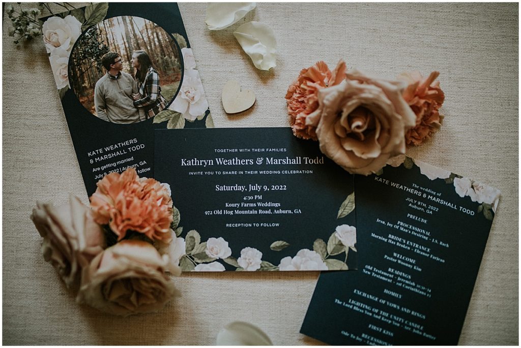 Invitation suite for a July wedding with burnt orange and brown flowers
