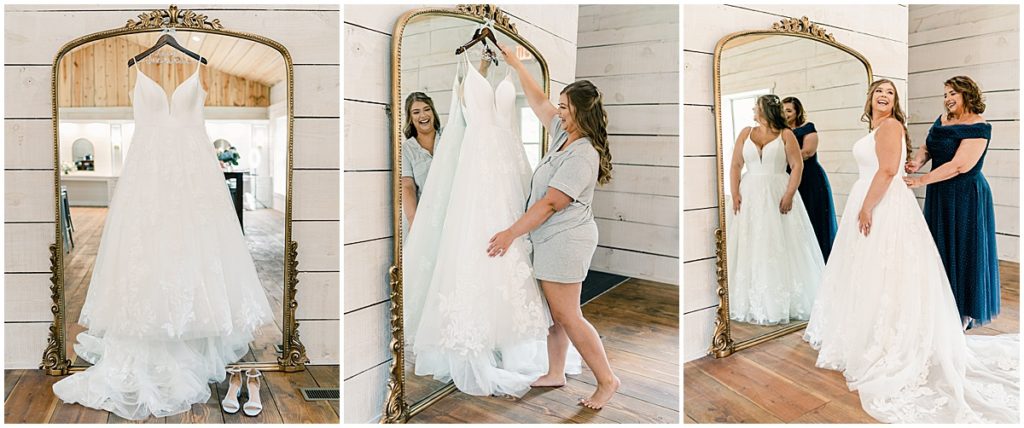 Bride getting into her dress in the bridal suite at North Georgia Barn Wedding