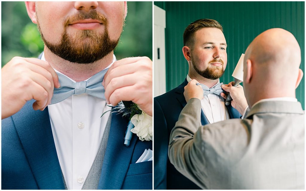 Groom getting ready wearing pastel blue bowtie and royal blue suit