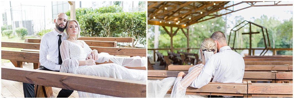 Bride and groom posing on pews at the ceremony site, covered pavillion at Koury Farms