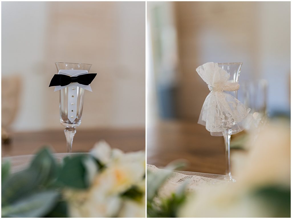 Champagne flutes with bride and groom attire details