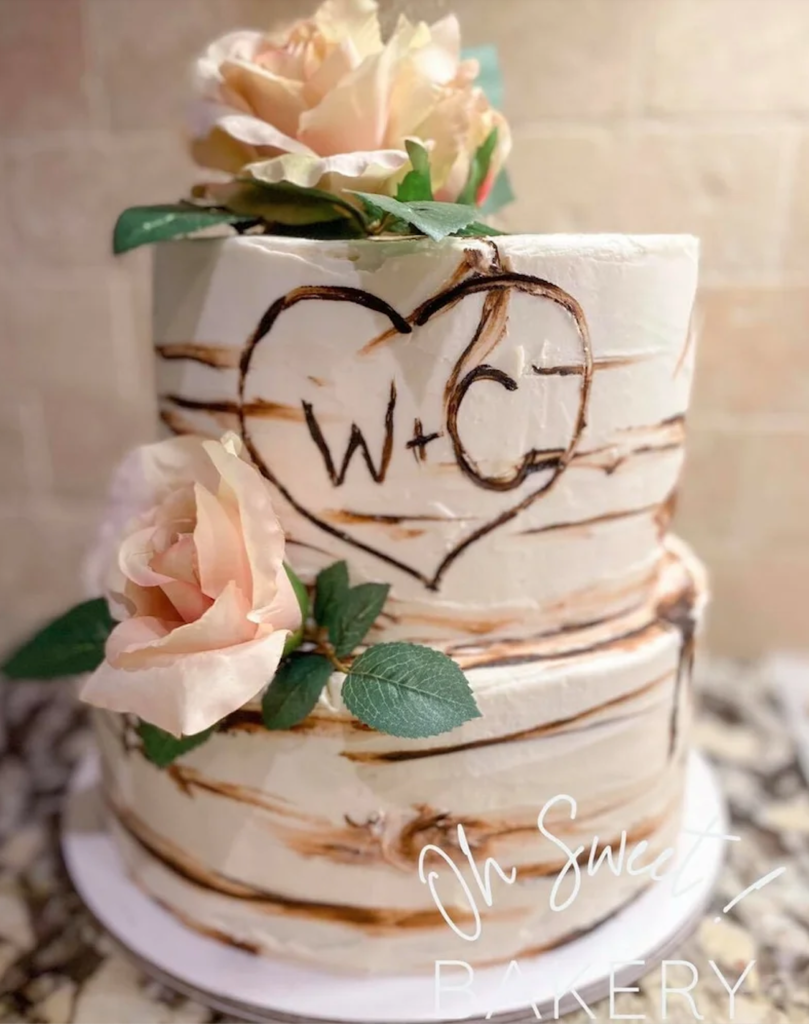 Naked style wedding Wedding cake with initials and florals 