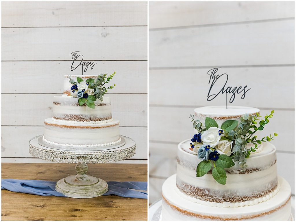 Semi naked white wedding cake with "the diazes" sign on top with green, blue and ivory florals