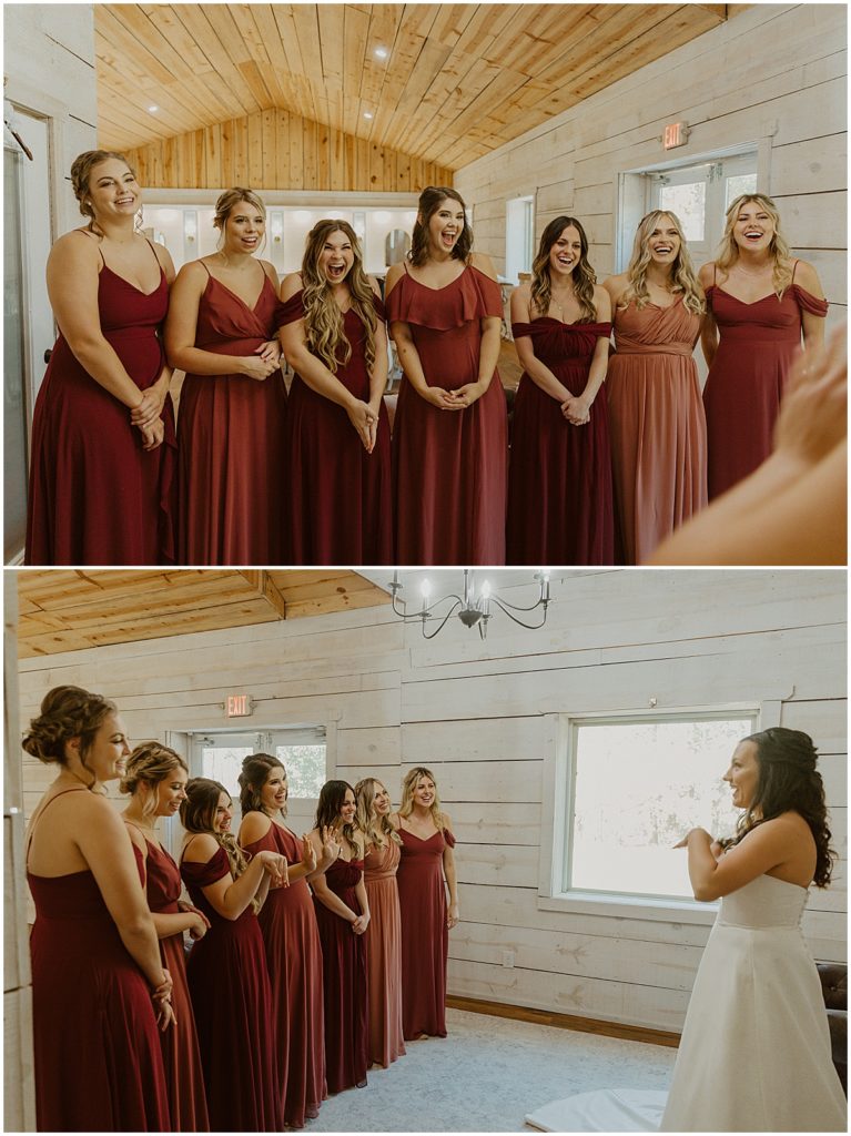 bridesmaids looking a brides. Bridesmaids all dressed in varying shades of wine red and dusty pink