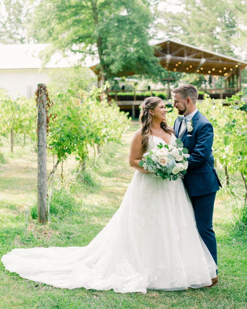 Bride and groom in the vineyards at Koury farms wedding venue in North Georgia