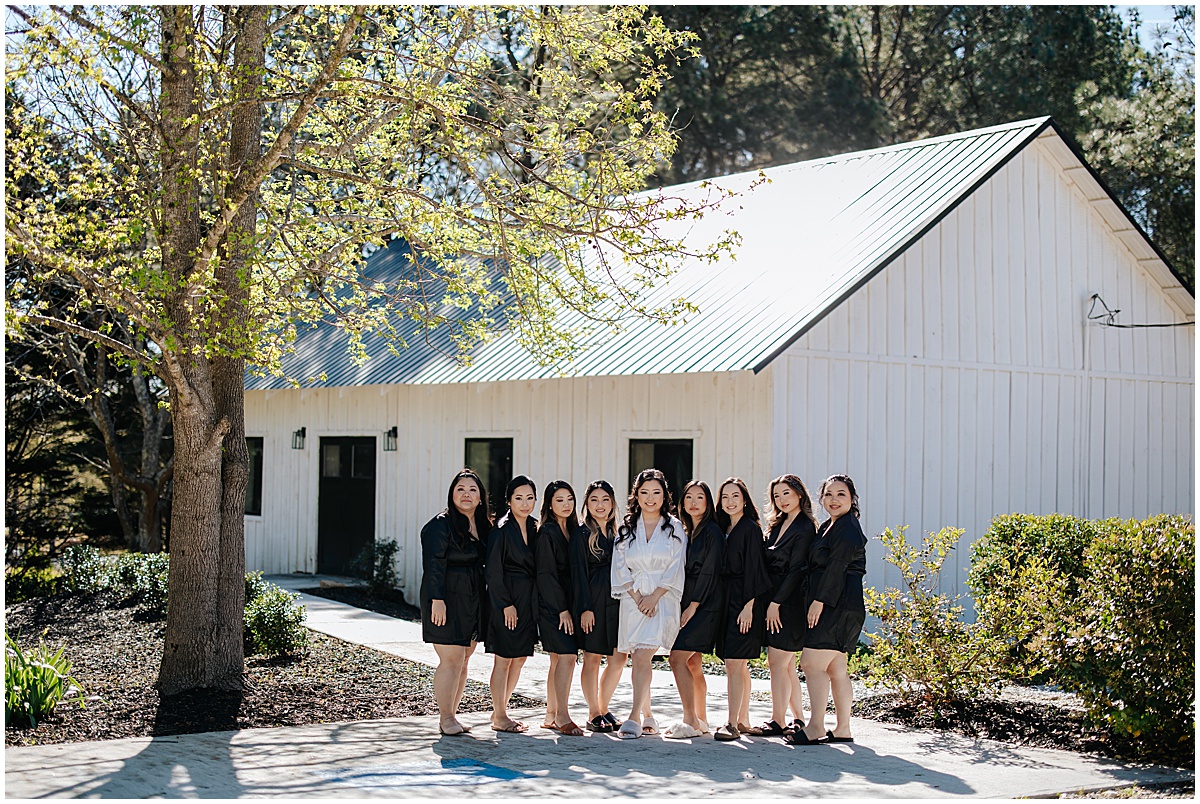 Bride with bridesmaids outside the bridal suite at Koury Farms wedding venue