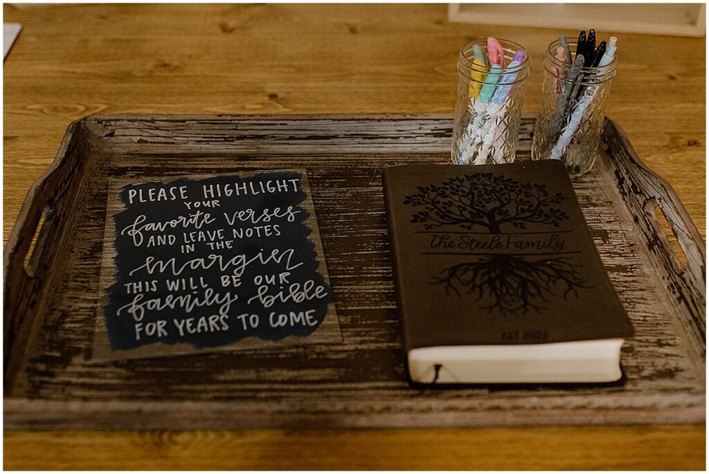 meaningful wedding idea of a bible where guests mark their favorite verse for bride and groom to keep