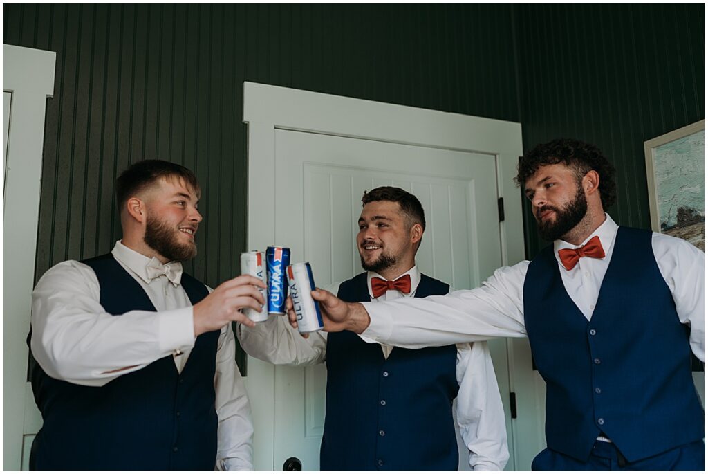 Groom with groomsmen sharing a beer