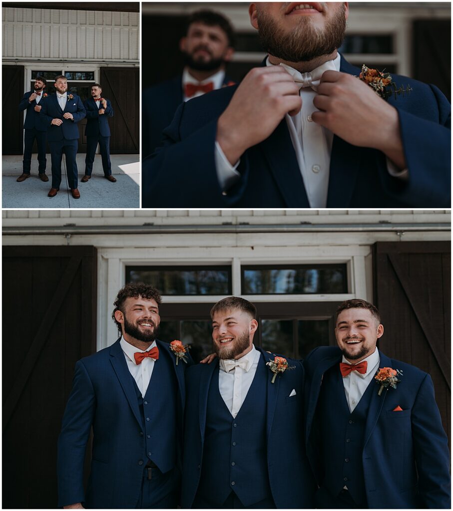Groom with groomsmen in dark blue suits and orange bowties