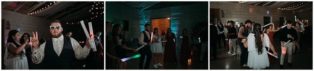 Guests having fun with glow sticks at wedding reception at Koury Farms
