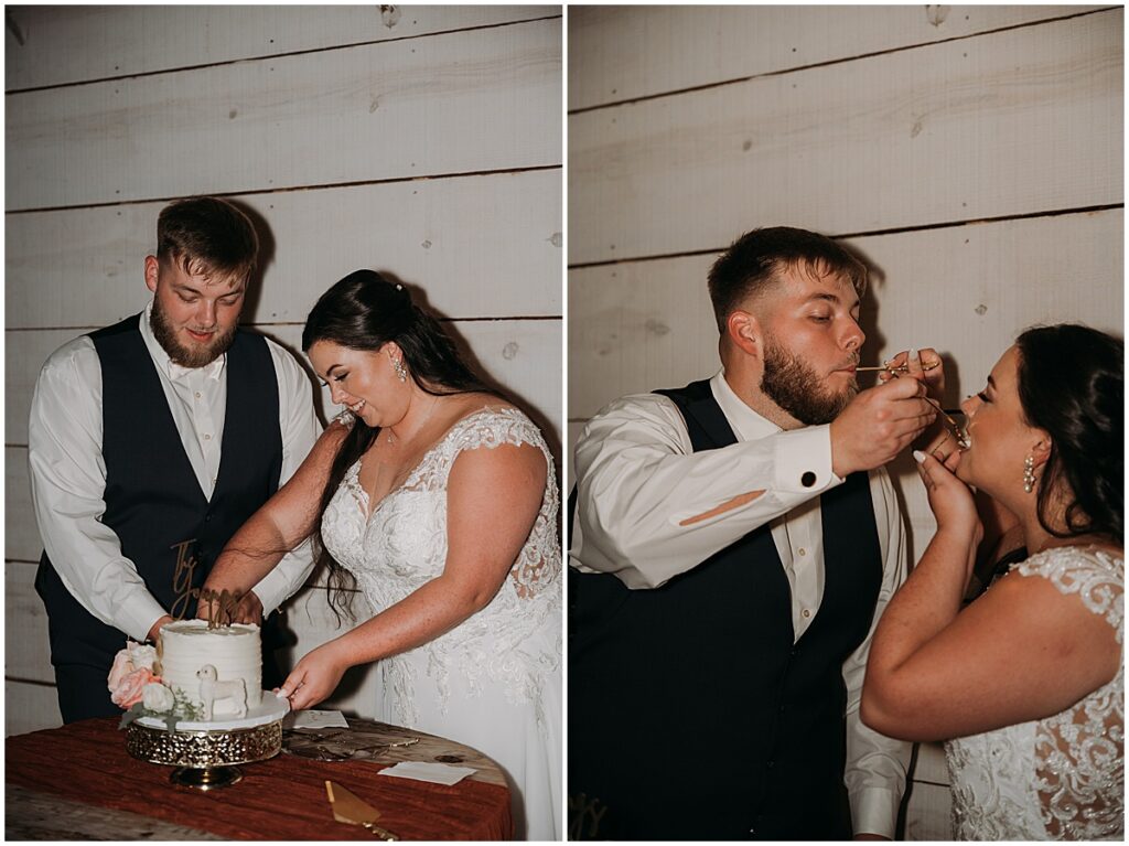 Bride and groom cutting the wedding cake and feeding each other a slice