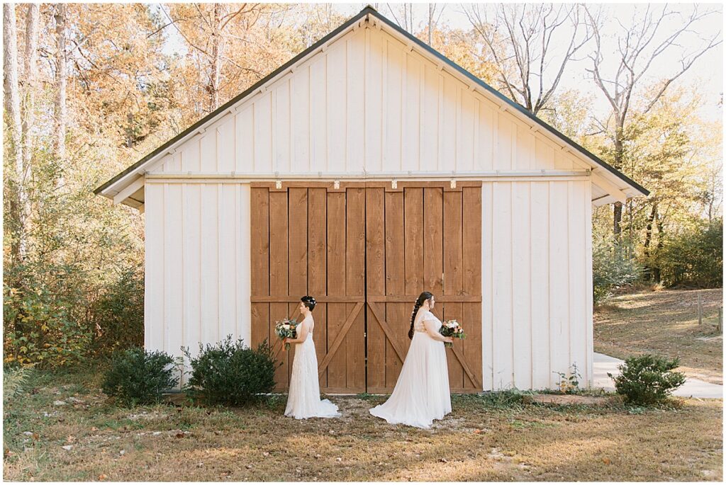 Bridal portraits outside the white barn at Koury Farms wedding venue in North Georgia