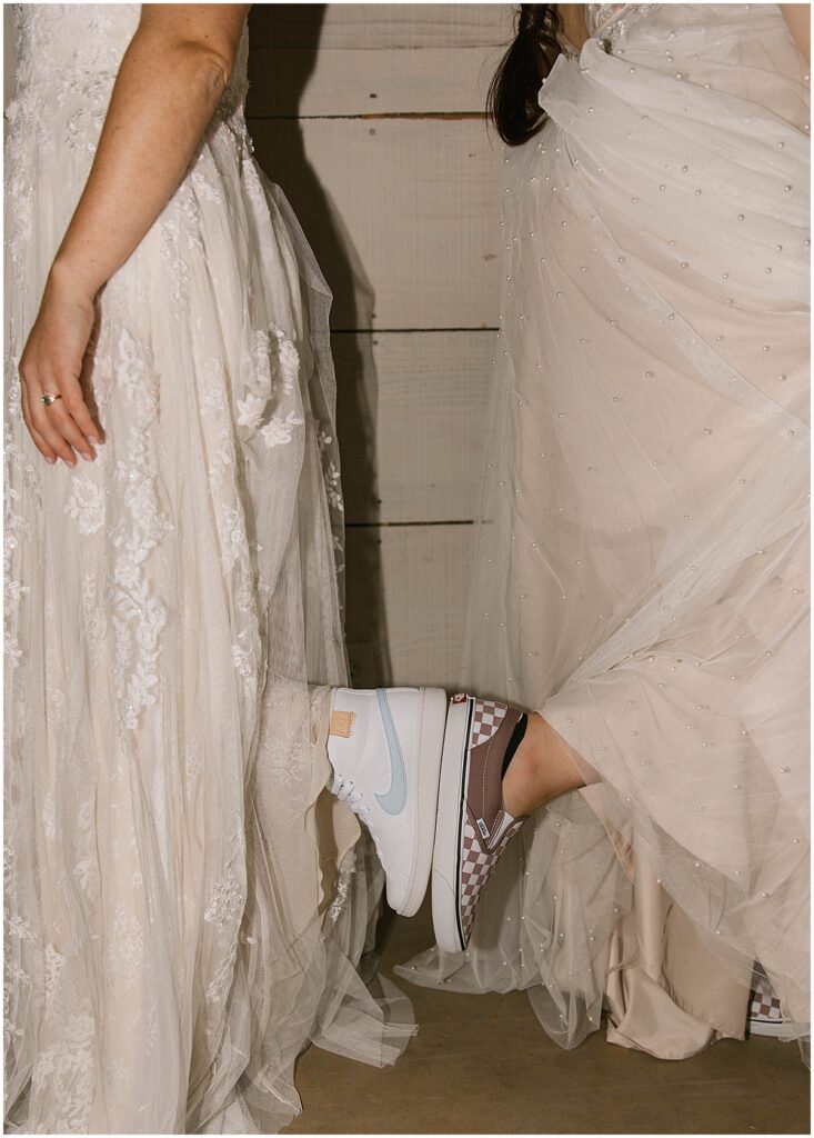 Brides wearing comfortable shoes at LGTBQ+ Friendly wedding venue in North Georgia