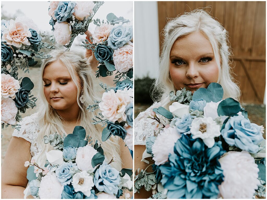 Bride surrounded by blue, white and pale peach florals with greenery for boho winter wedding