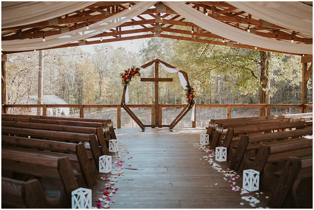 wedding ceremony for emerald green and fuschia wedding at koury farms