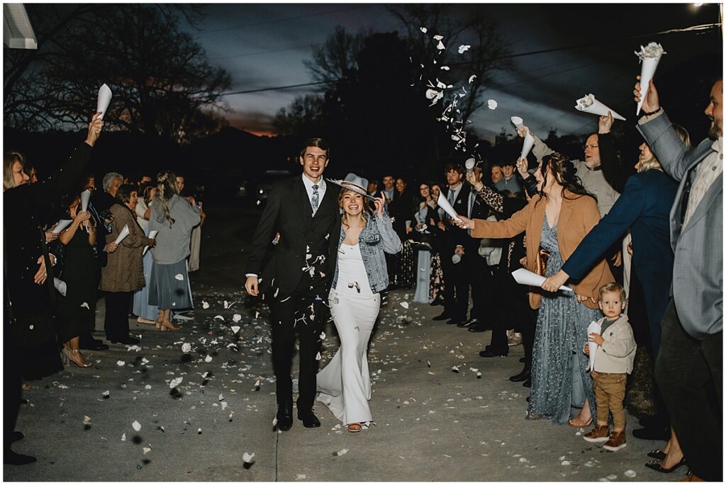 Bride and groom wedding exit with confetti