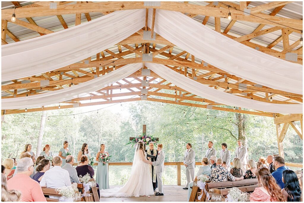 wedding ceremony at the covered pavilion at koury farms