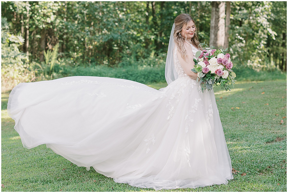 bridal portraits in the grounds of koury farms fairytale vineyard wedding