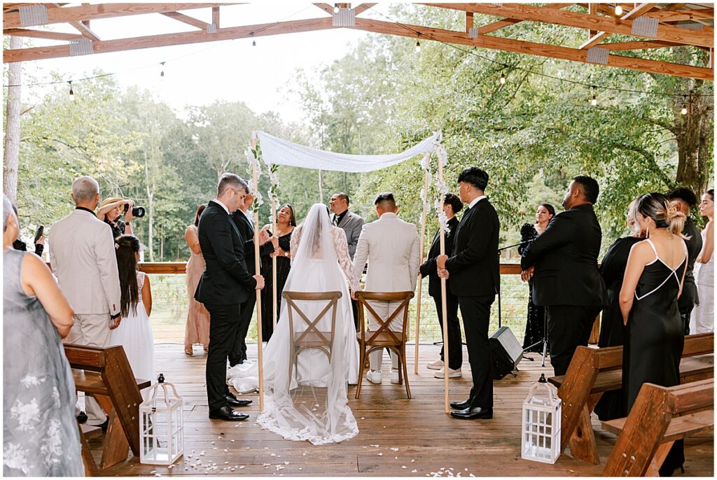 Wedding ceremony at outdoor covered pavilion at Koury farms
