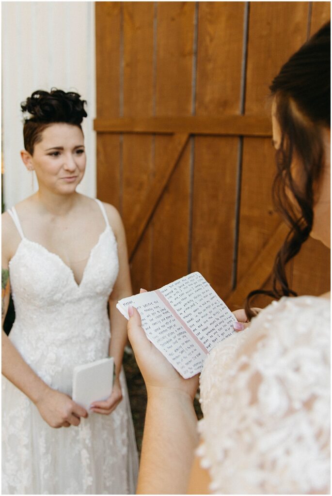 Brides reading love letters to each other on the wedding day