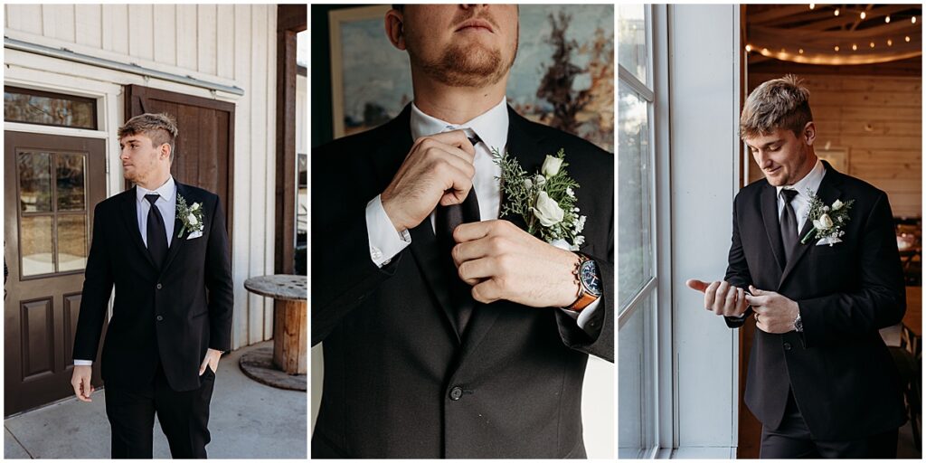 Groom wearing black suit with wine florals and pine tree springs for winter wedding in North Georgia