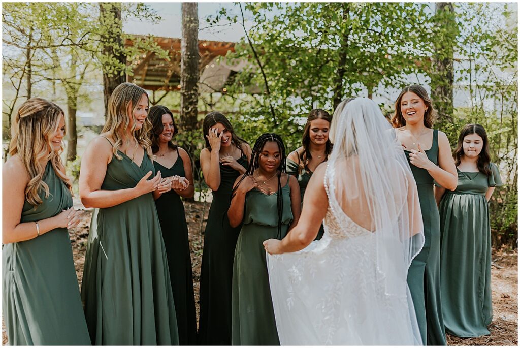 Bride doing first look with bridesmaids