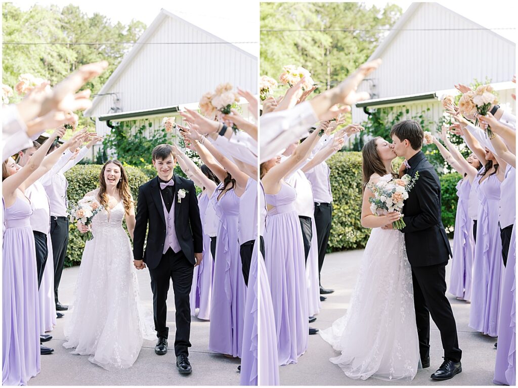 Bride and groom walking down as bridal party raise their arms