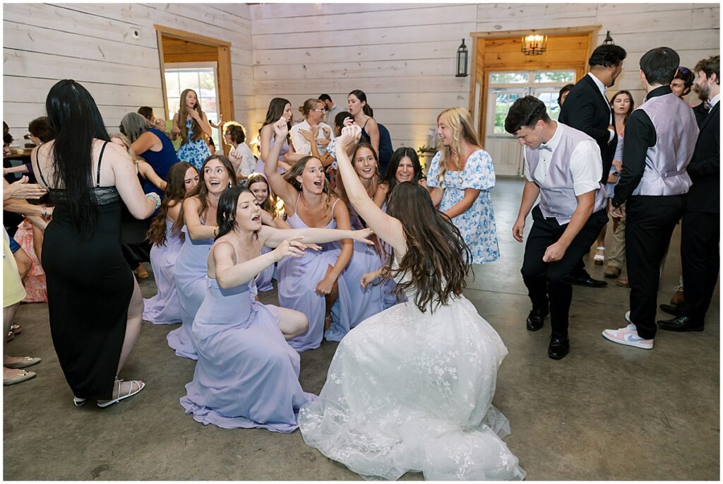 Wedding guests dancing at wedding reception