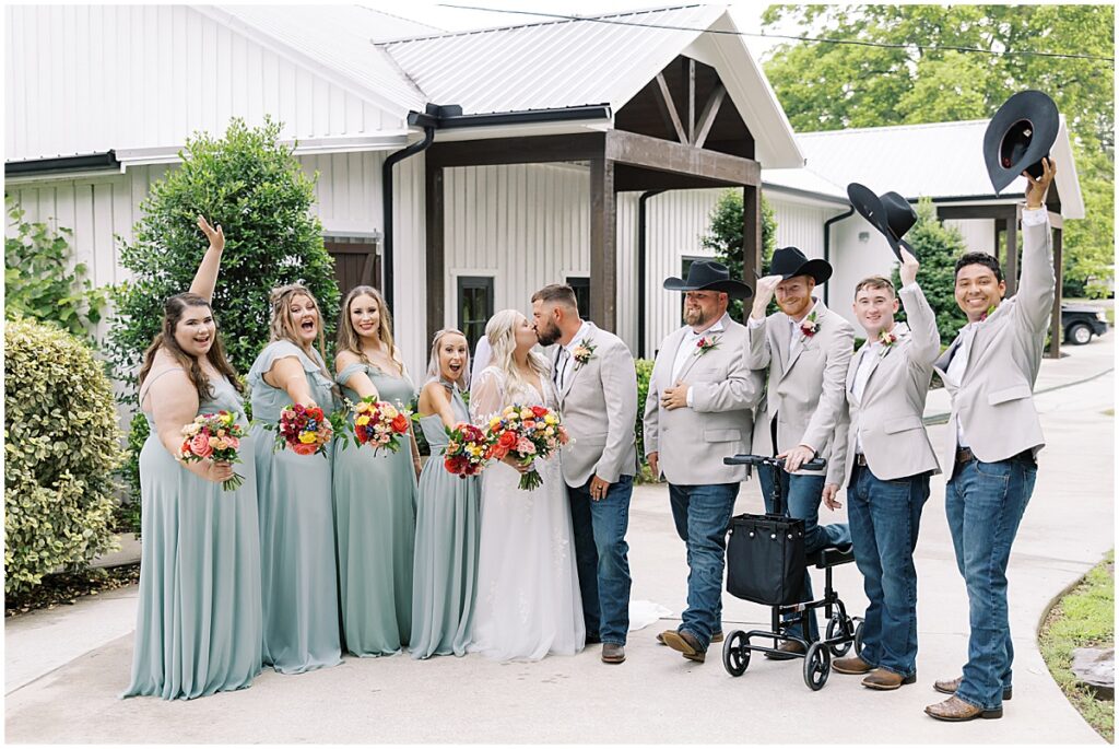 Bride and groom with wedding party at Koury Farms wedding venue