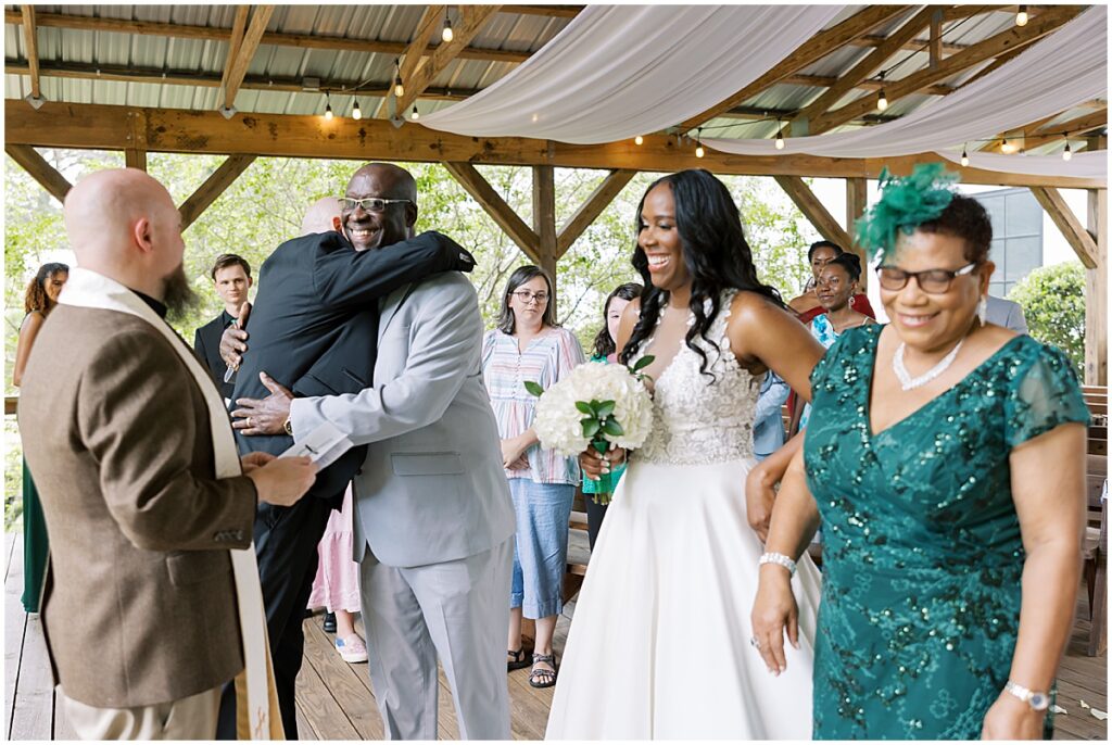 Bride arriving at the alter at outdoor wedding at Koury Farms