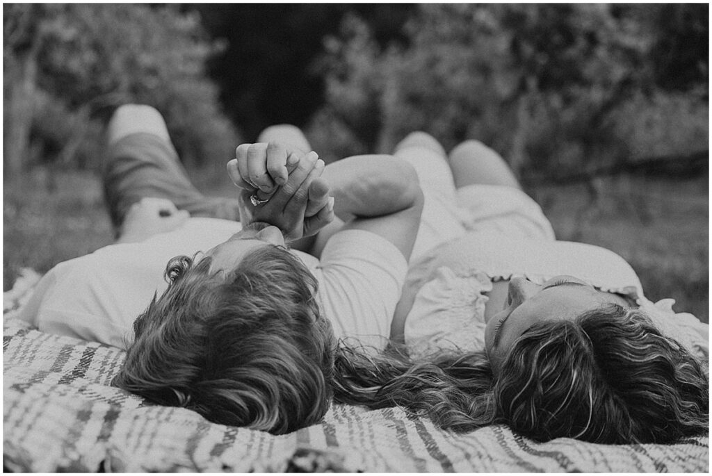 Couple lying on a picnic blanket at Koury Farms