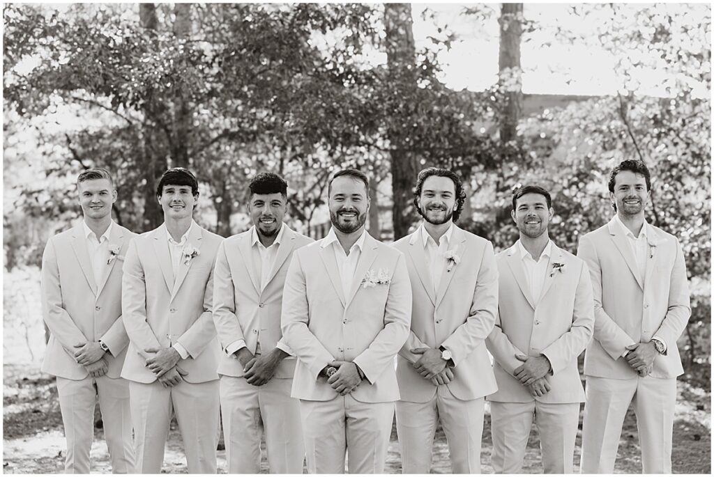 Grooms men wearing cream suits for wedding at Koury Farms, North Georgia