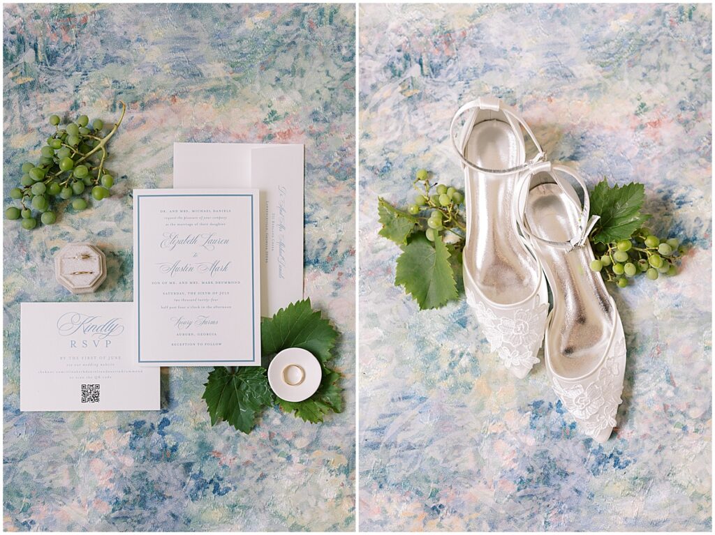 Wedding details against a watercolor backdrop and grapes for a summer vineyard wedding