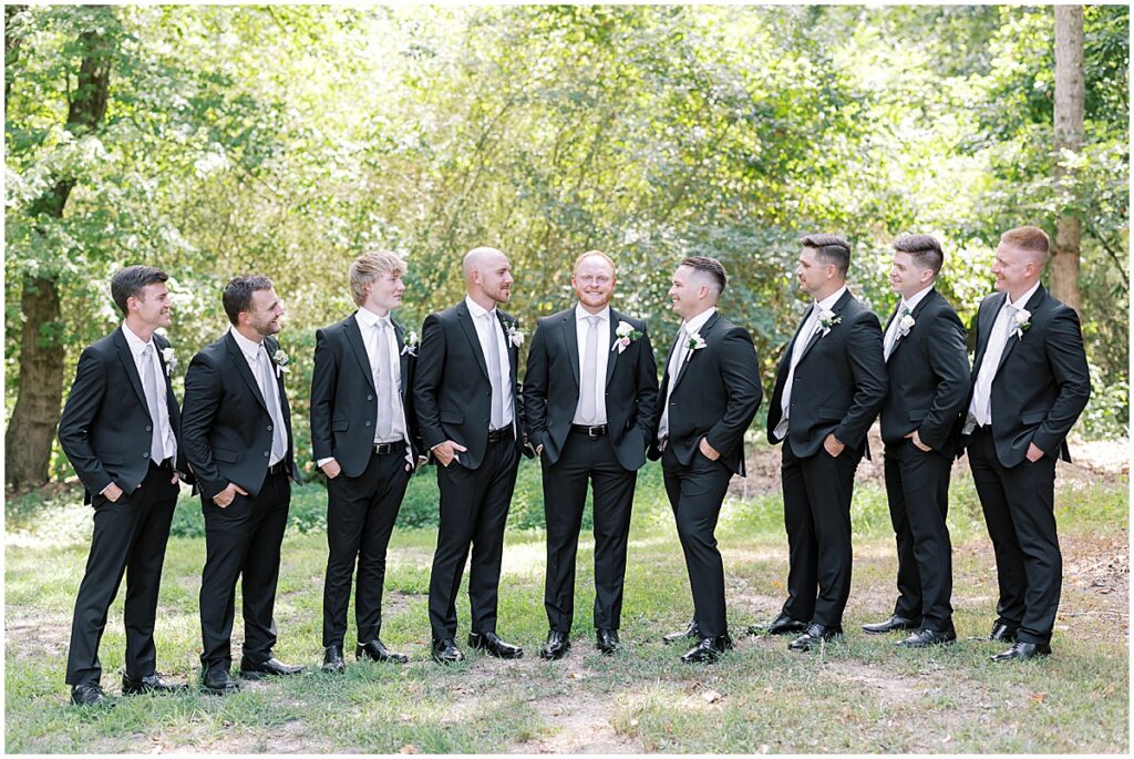 Groom with groomsmen at summer vineyard wedding at Koury Farms