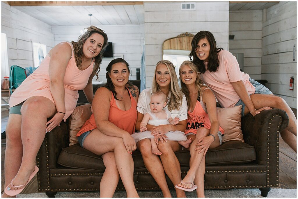 Bride with bridesmaids wearing peach color