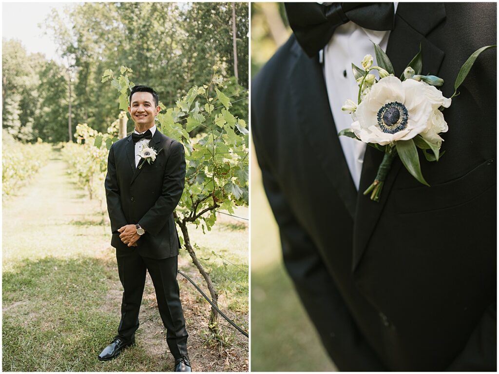 Groom in the vineyards at Koury Farms wearing black tuxedo with white boutonnaire