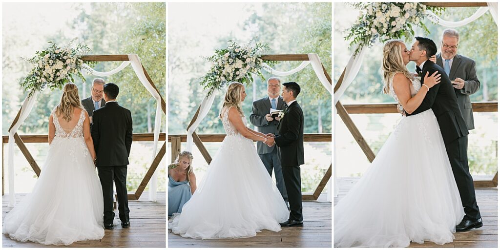 Wedding ceremony overlooking vineyards with ivory florals and hexagonal wooden arch