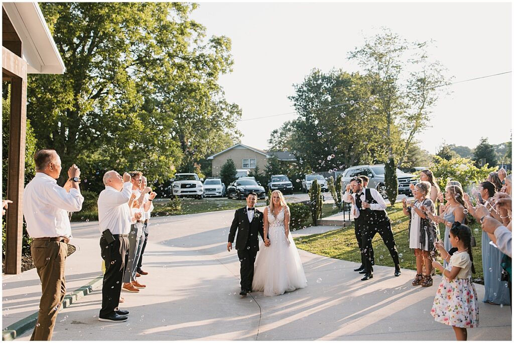 wedding exit with bubbles at Koury Farms