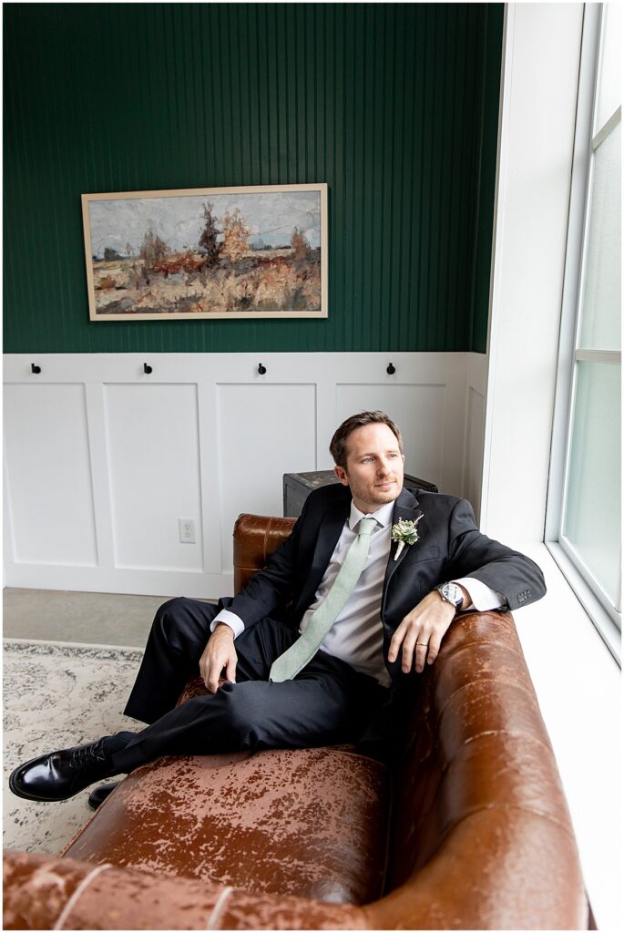 Groom relaxing in Grooms suite at Koury Farms