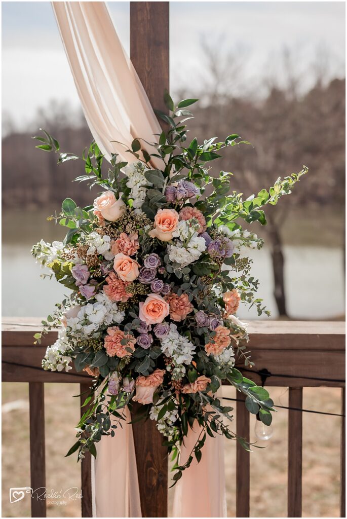 Flower arrangement on a arch designed by divine florals studio