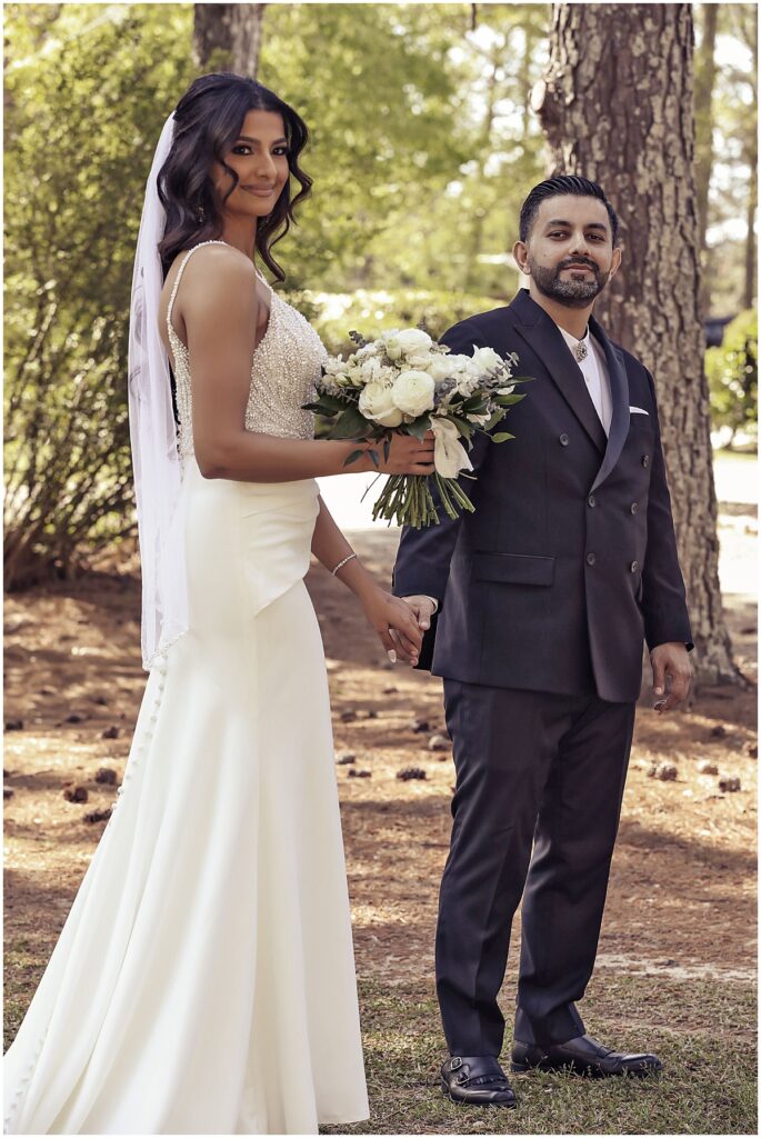 Bride holding bouquet of white florals