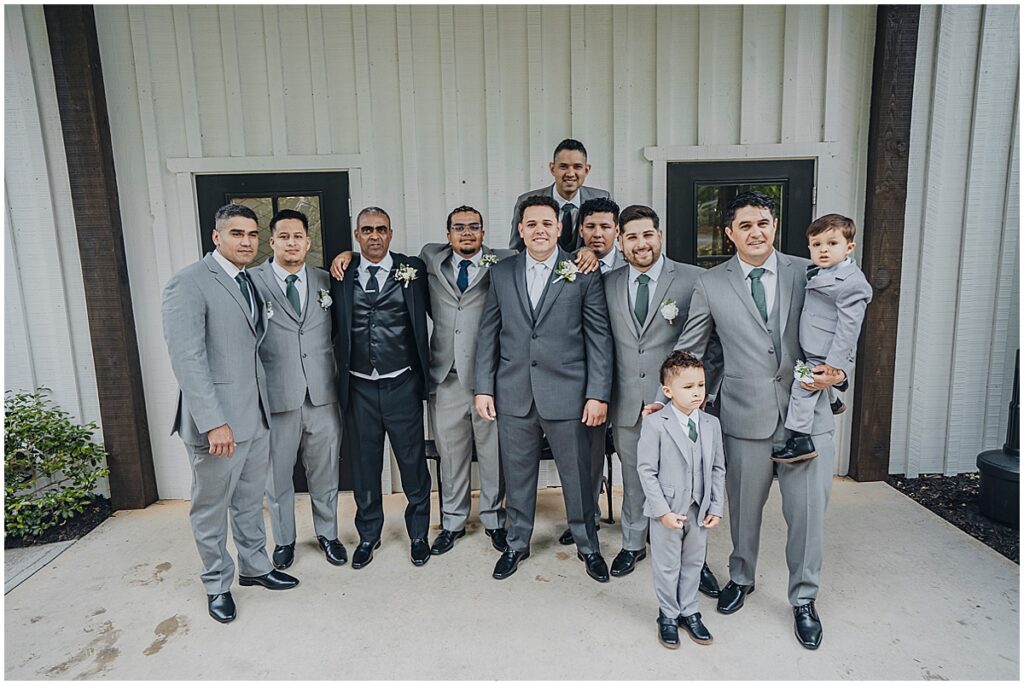 groom with groomsmen in silver suits