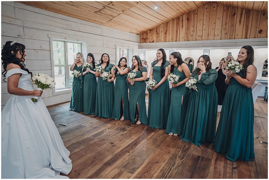bride with bridesmaids in emerald green