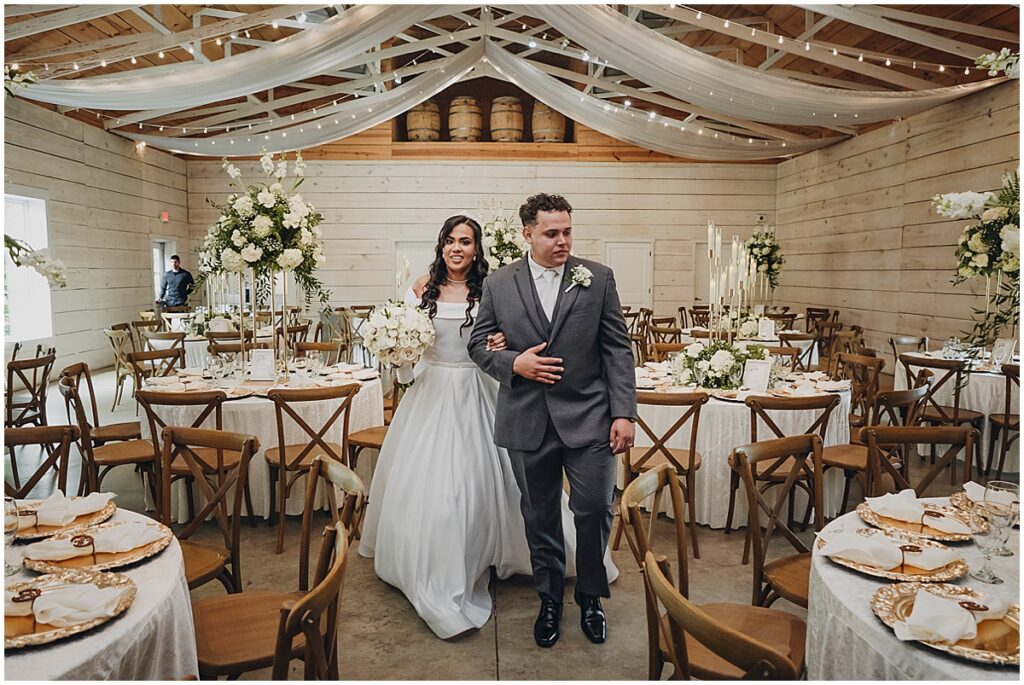 bride and groom looking at reception area