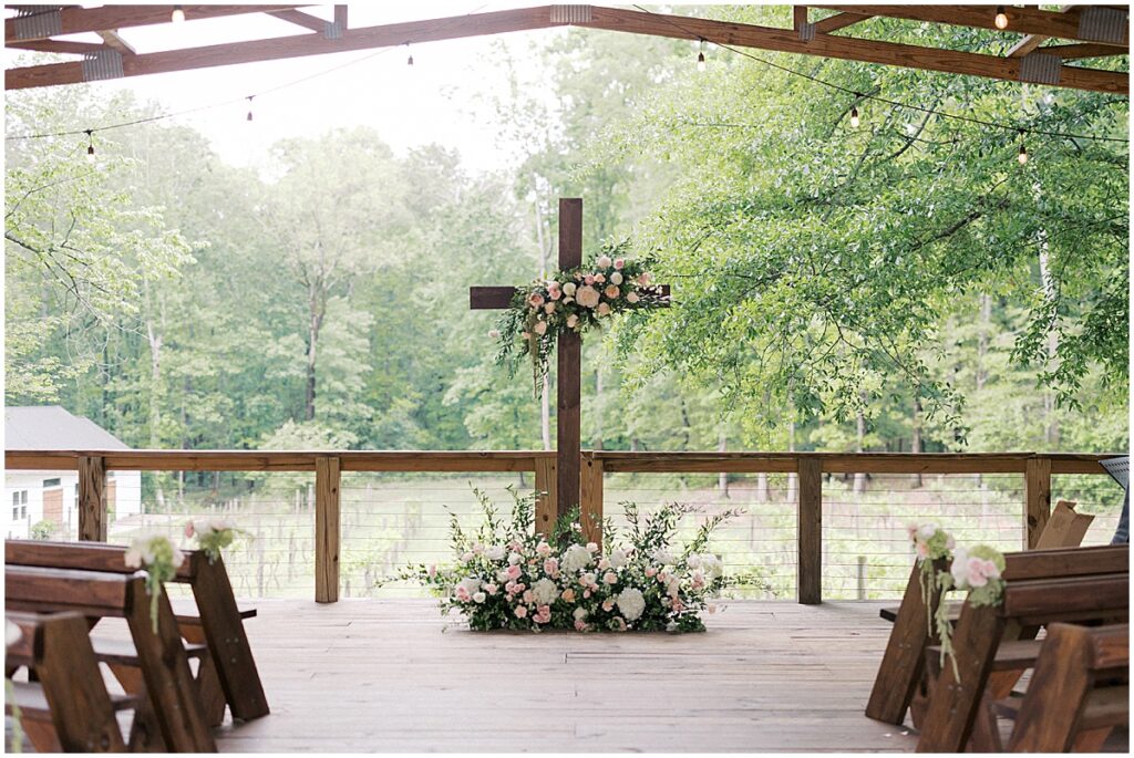 Cross ceremony centerpiece at Koury Farms decorated with florals