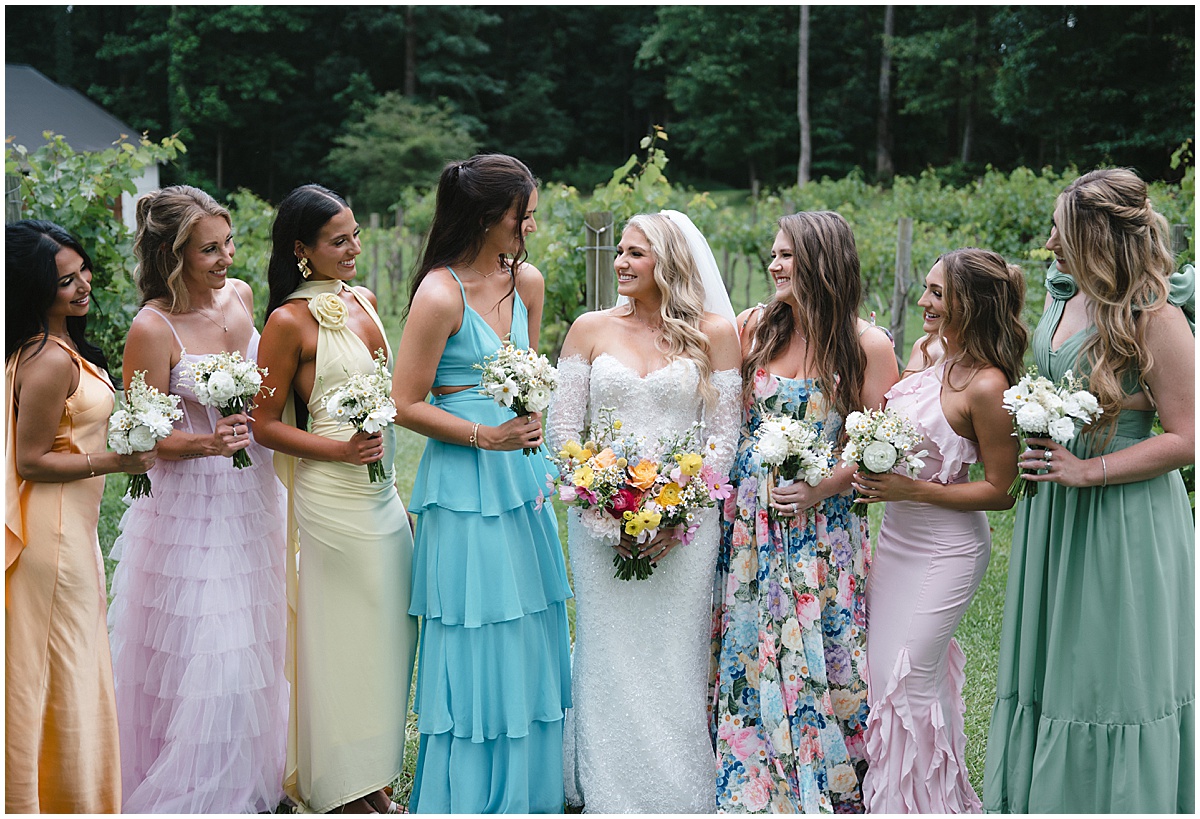 Bridesmaids in colorful dresses for floral inspired wedding